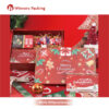 Red Christmas gift box with assorted snacks and inner compartments